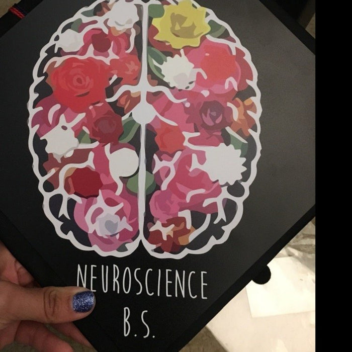 Hand holding floral brain Neuroscience BS topper