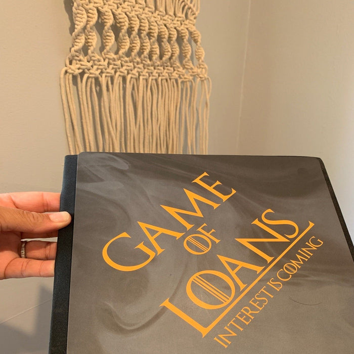 Hand holding Game Of Loans topper