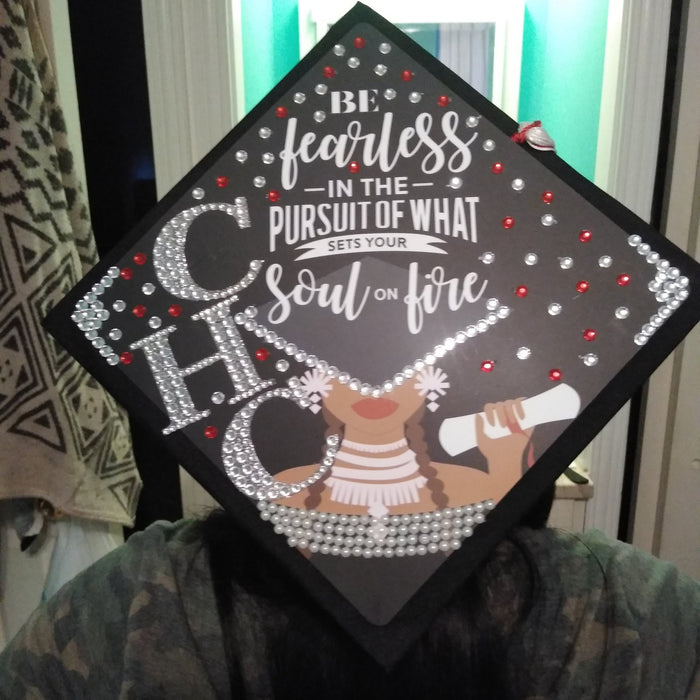 Person wearing rhinestone Be Fearless CHC cap