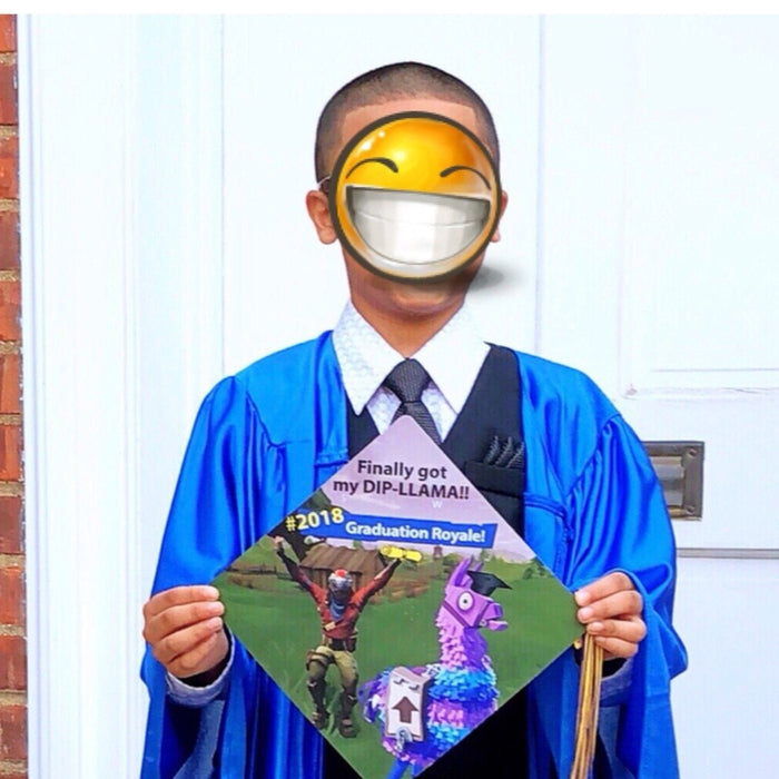 Boy in blue gown holding Fortnite Dip-llama cap