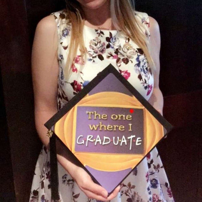 Woman holding Friends The One Where I Graduate cap