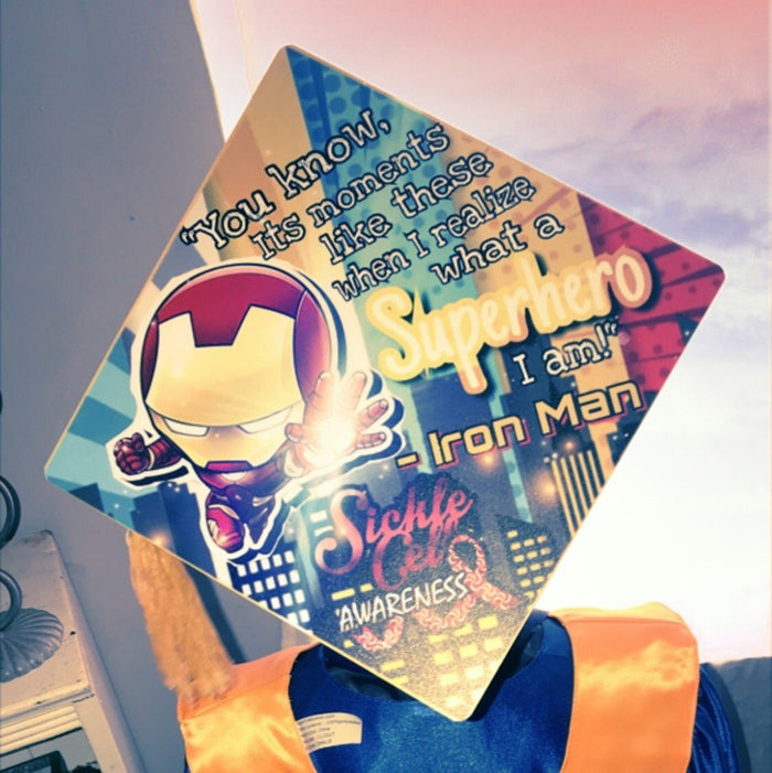 Person holding Iron Man Superhero sickle cell cap