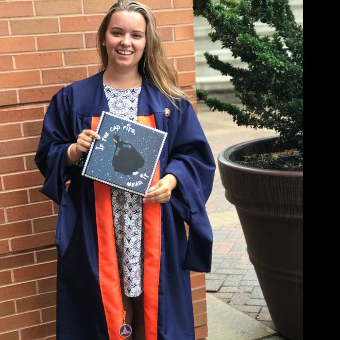 Graduate holding moon and stars cap