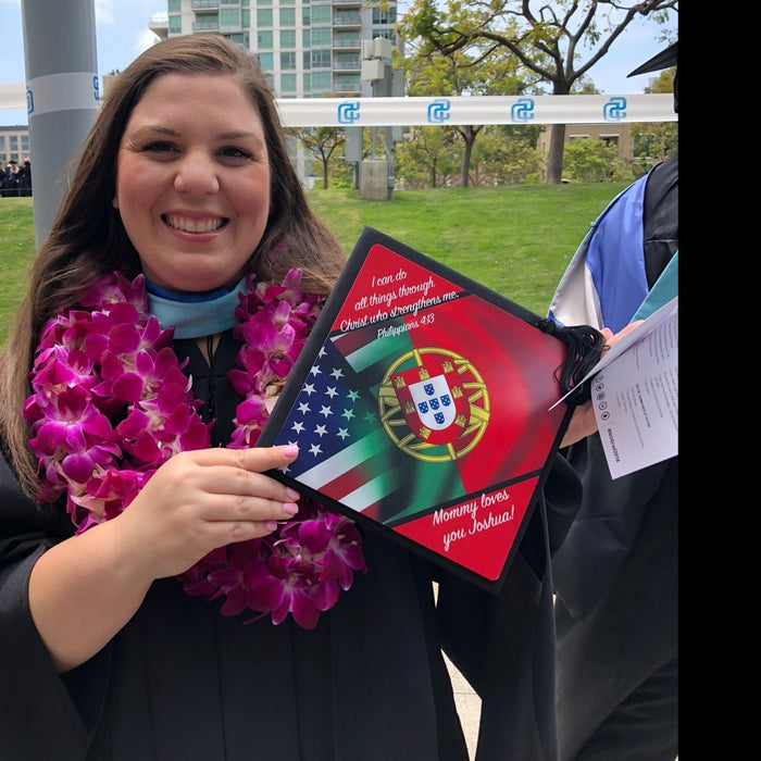 Graduate holding US Portugal flag cap