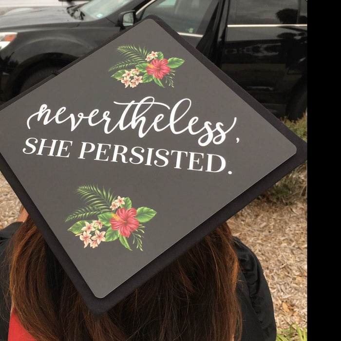 Graduate wearing Nevertheless She Persisted cap