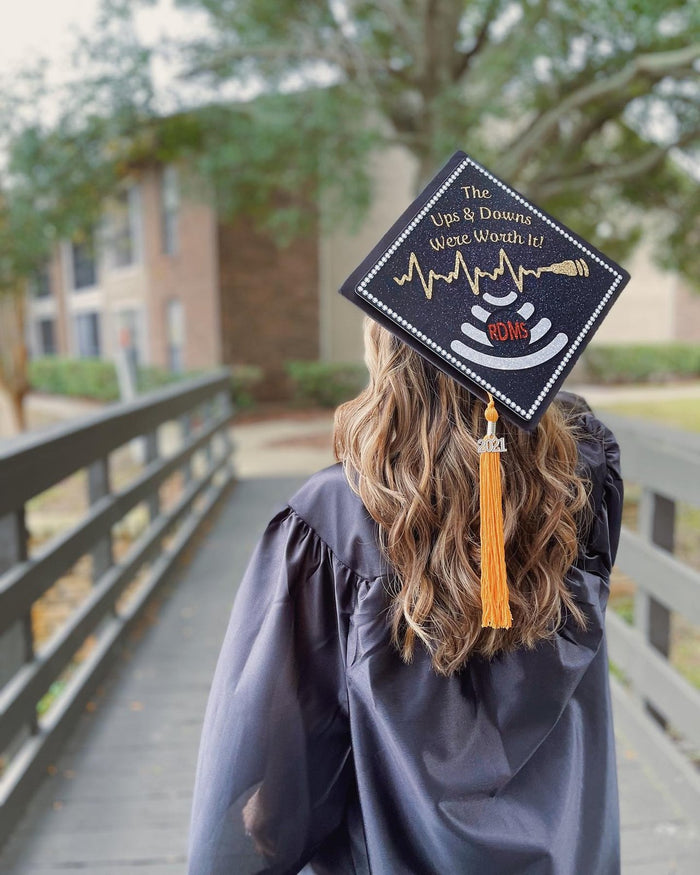Graduate wearing ultrasound cap on bridge