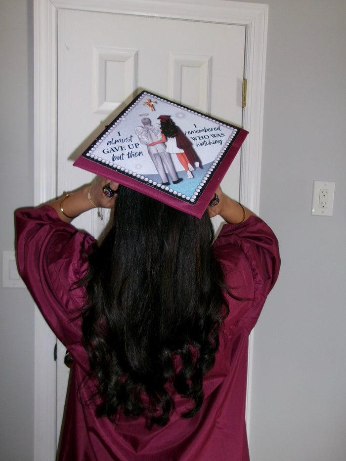 Graduate holding photo nurse topper on head