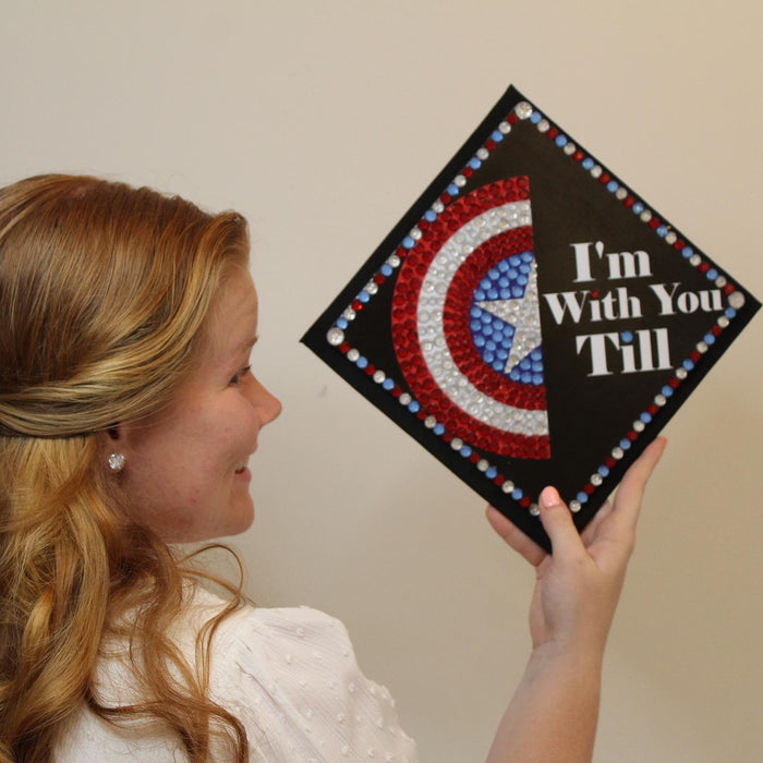 Woman holding Captain America shield cap