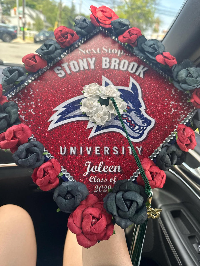 Stony Brook Joleen rose cap on graduates lap in car