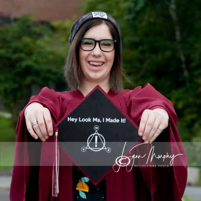 Graduate holding Hey Look Ma I Made It cap