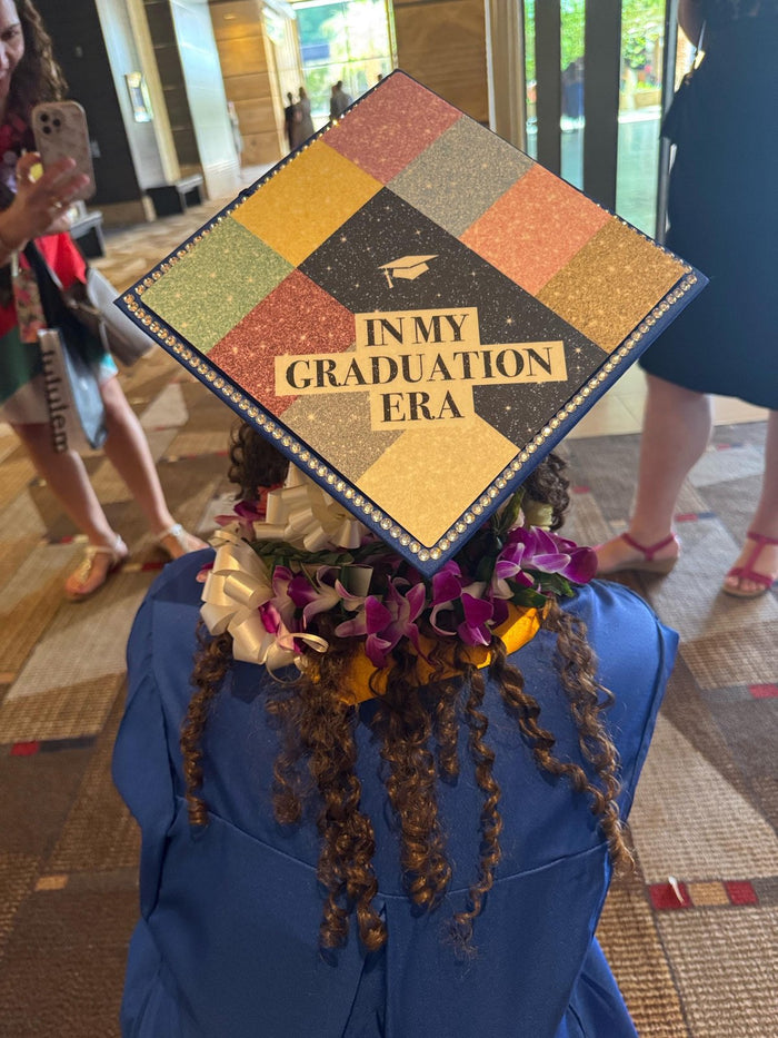 Graduate wearing In My Graduation Era patchwork cap