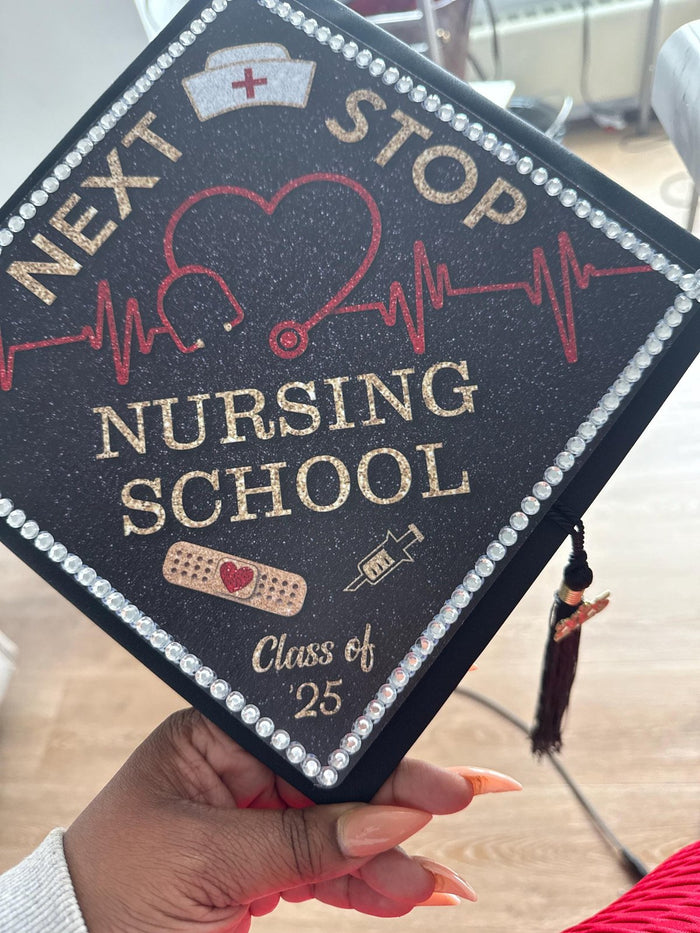 Hand holding Next Stop Nursing School topper