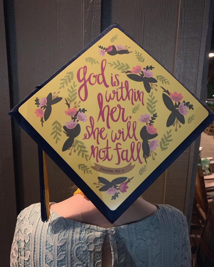 Person wearing God Is Within Her butterfly cap