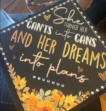 She Turned Her Cants Into Cans topper on lap