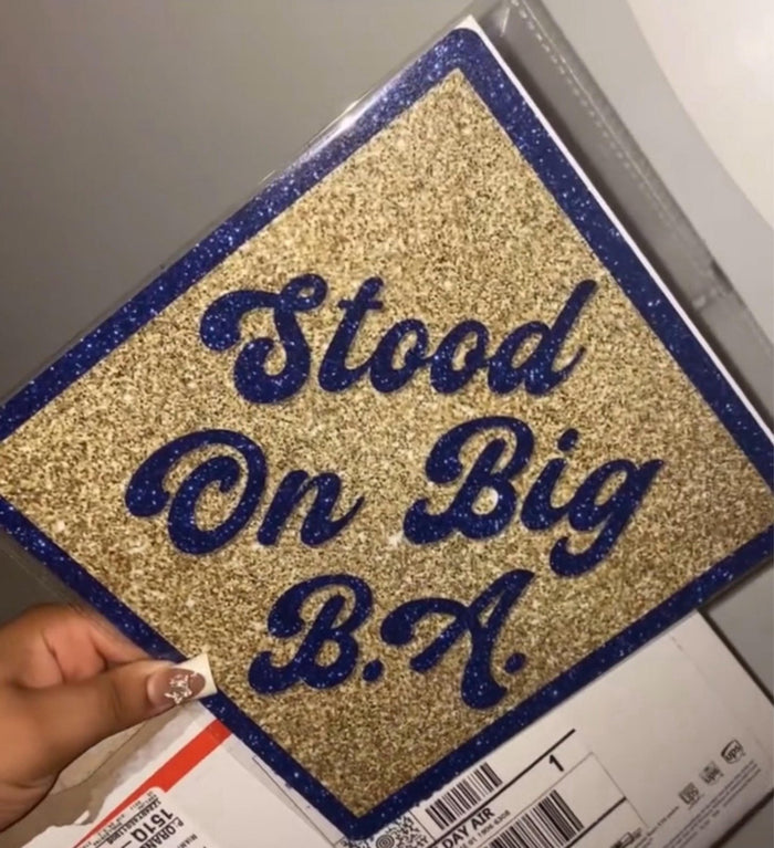Hand holding Stood On Big BA glitter topper