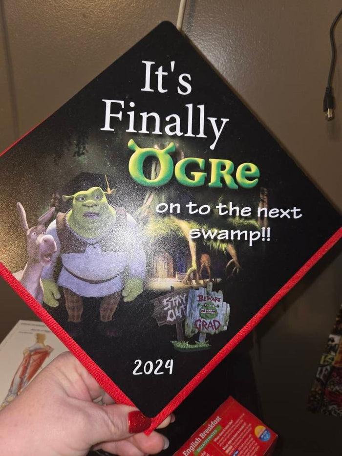 Hand holding Shrek Its Finally Ogre topper