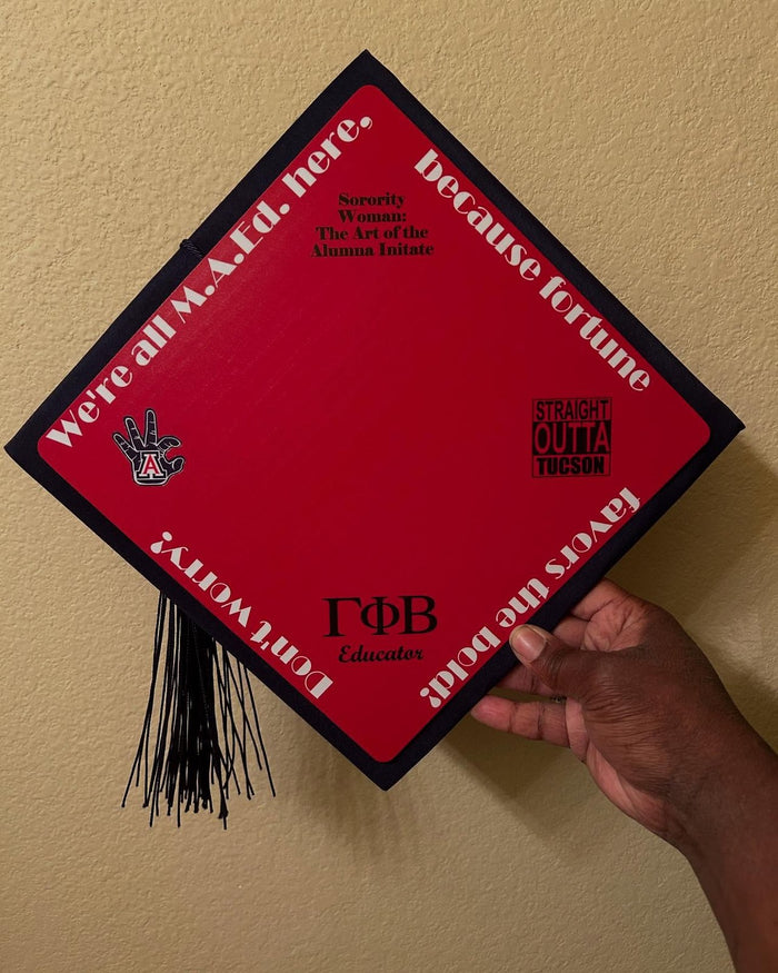 Hand holding red Gamma Phi Beta mad here topper
