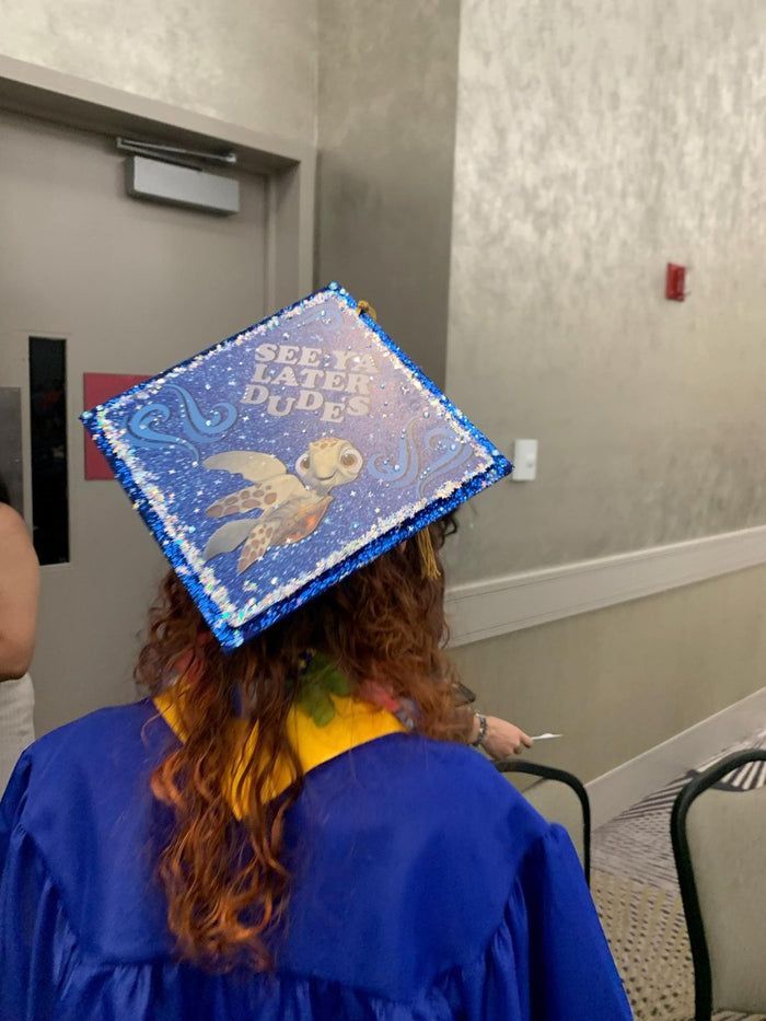 Graduate wearing Nemo See Ya Later Dude cap