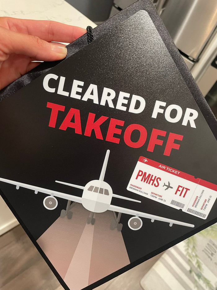 Hand holding Cleared For Takeoff airplane topper