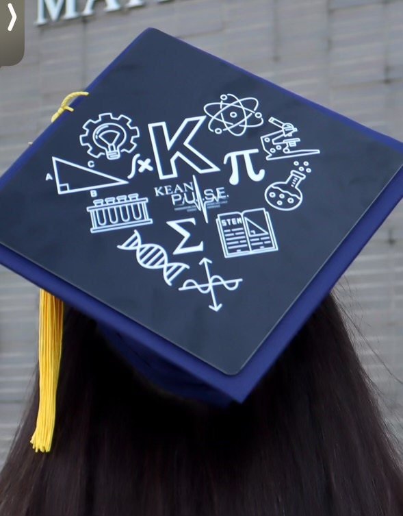 Graduate wearing STEM icons cap