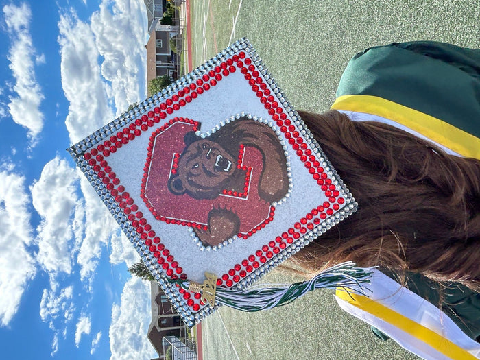 Graduate wearing Cornell bear topper