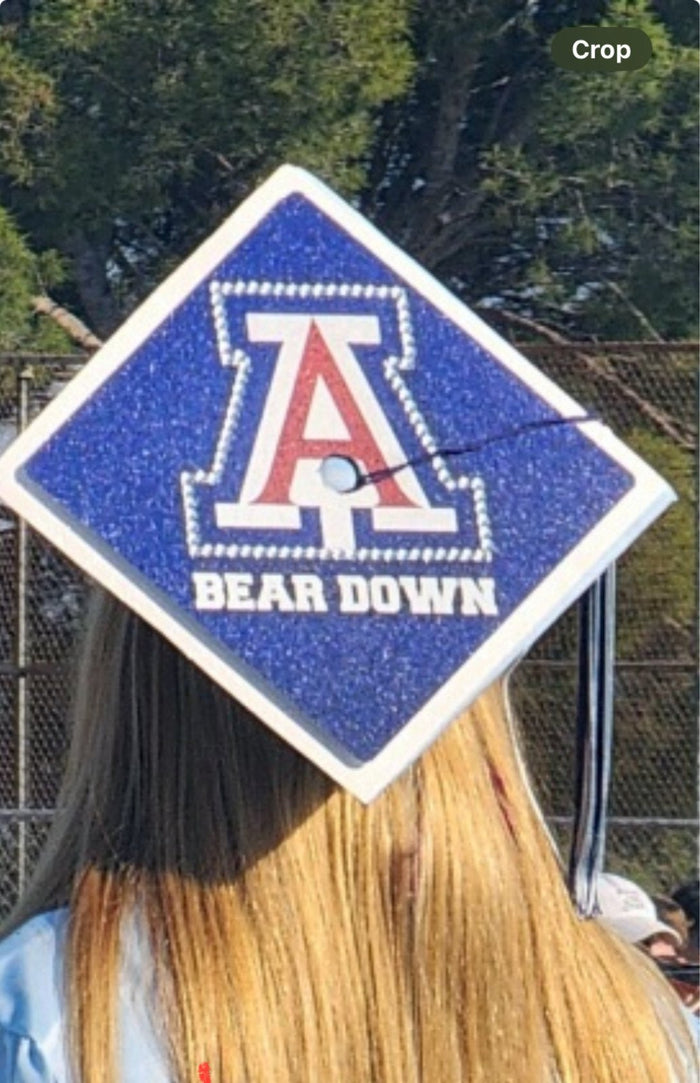Graduate wearing Arizona Bear Down cap