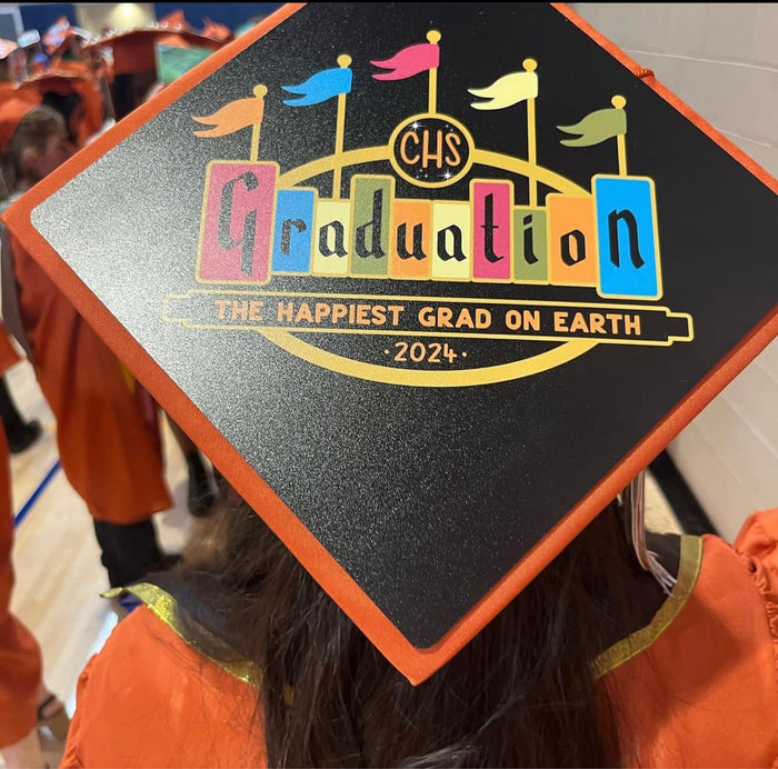 Child wearing Disneyland Graduation 2024 cap