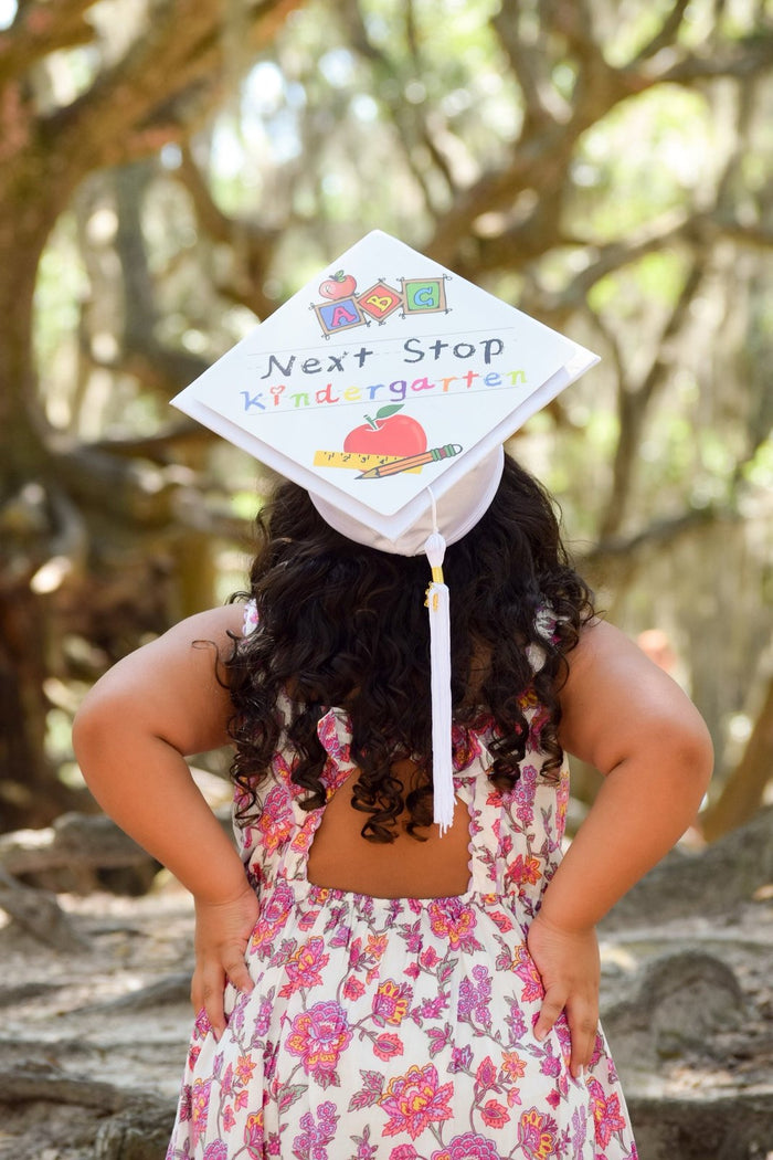 Young girl wearing Next Stop Kindergarten cap