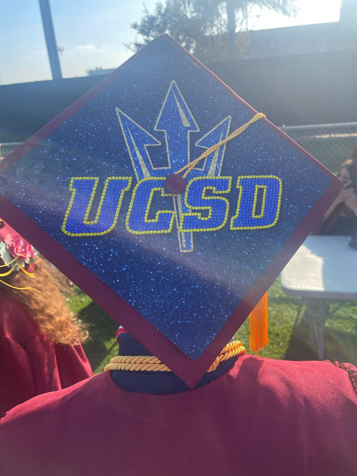 Graduate wearing UCSD trident cap