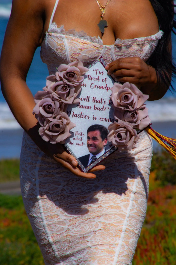 Woman holding Michael Scott rose memorial topper