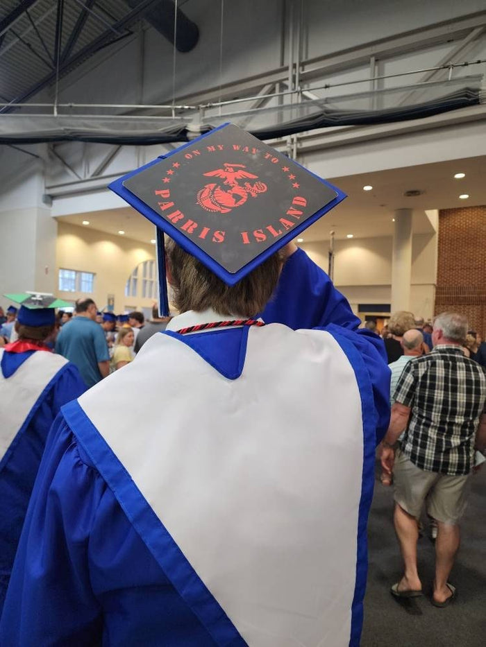 Graduate wearing Parris Island Marines cap