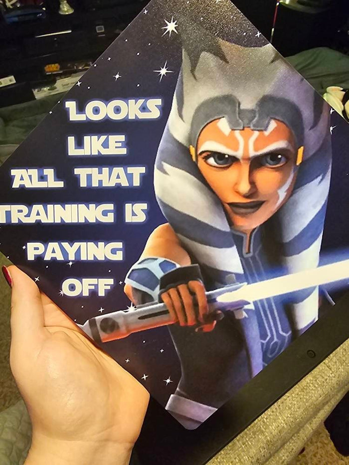 Hand holding Ahsoka Training Paying Off topper