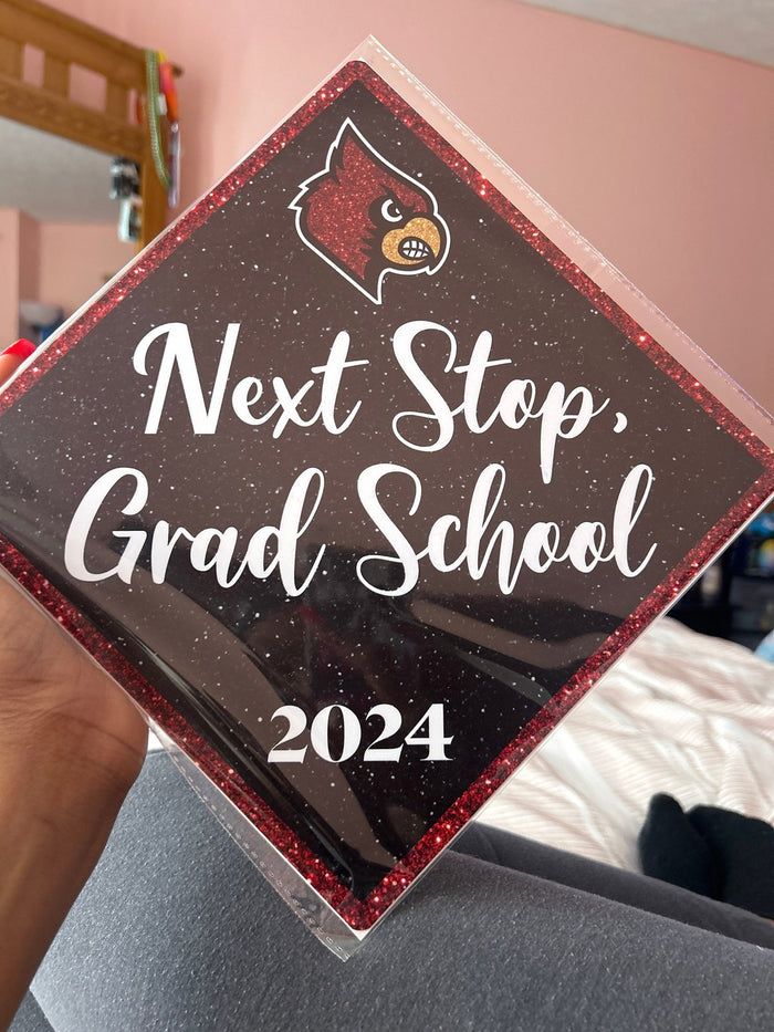 Arm holding Louisville Next Stop Grad School topper