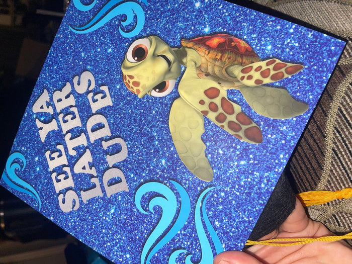 Hand holding Nemo See Ya Later Dudes topper