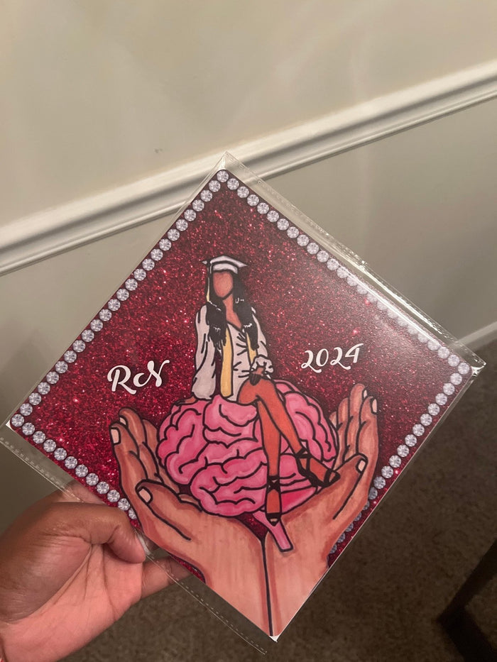 Hand holding RN brain 2024 topper