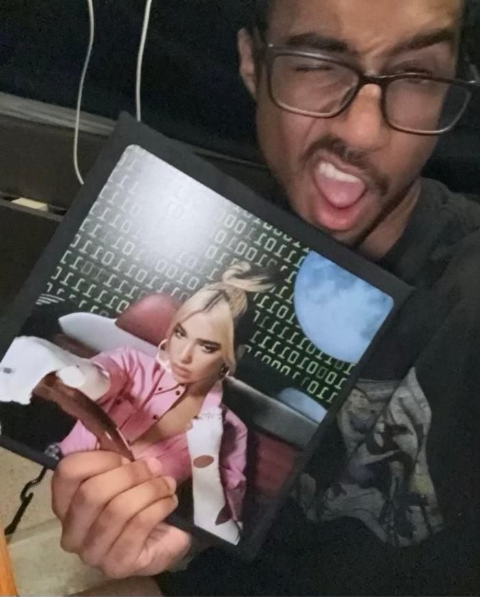 Man holding Billie Eilish matrix topper selfie