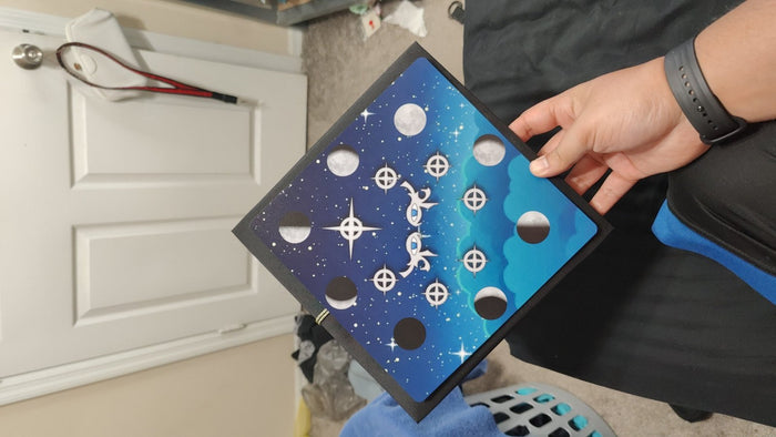Hands holding moon phases galaxy topper