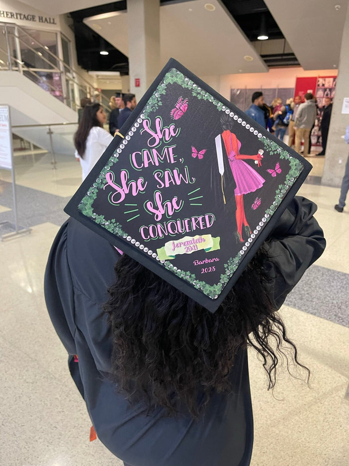 Graduate wearing She Came She Saw She Conquered cap