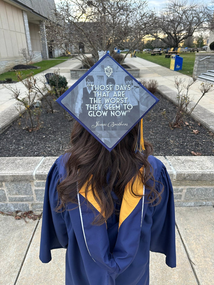 Graduate wearing Worst Days Glow Now cap