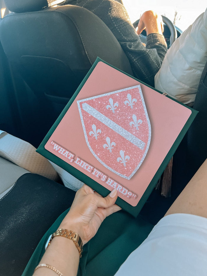Hand holding What Like Its Hard shield topper in car
