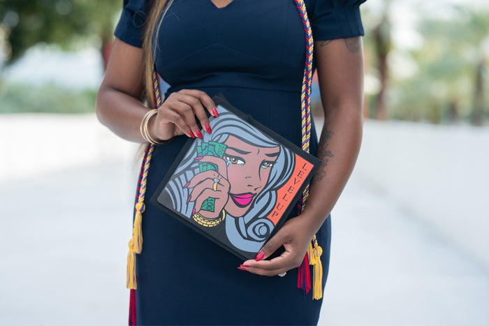 Woman holding Level Up pop art cap outdoors