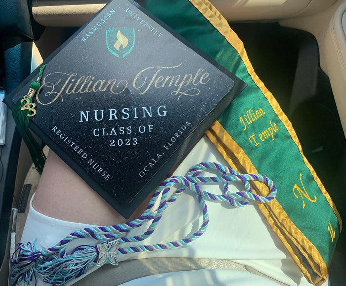 Jillian Temple Nursing 2023 cap on lap in car