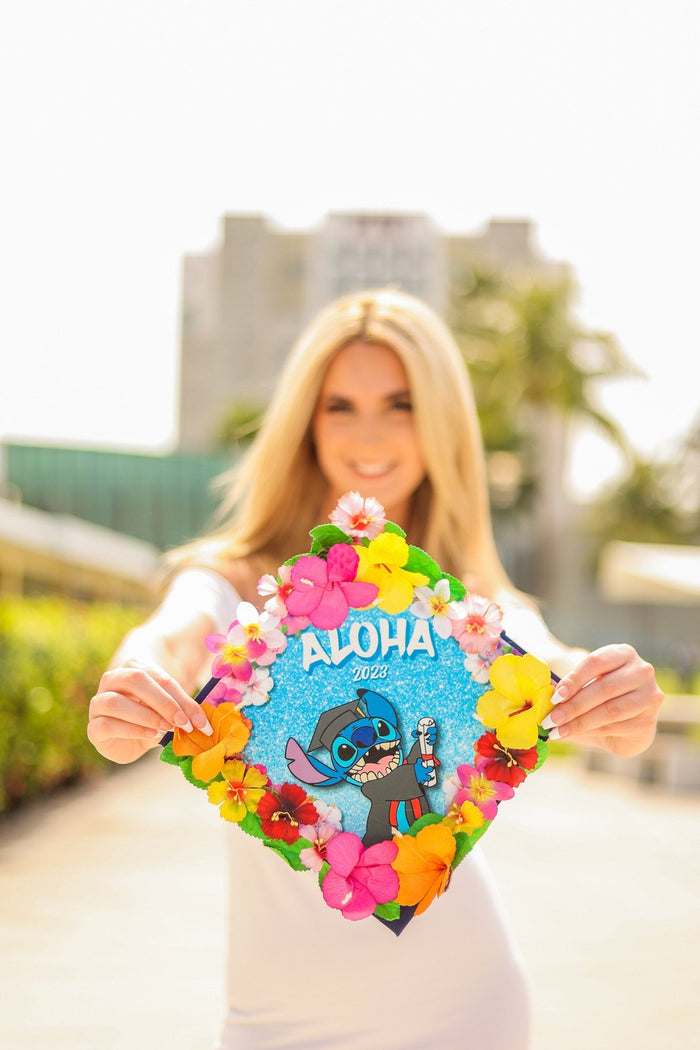 Woman holding Stitch Aloha floral topper