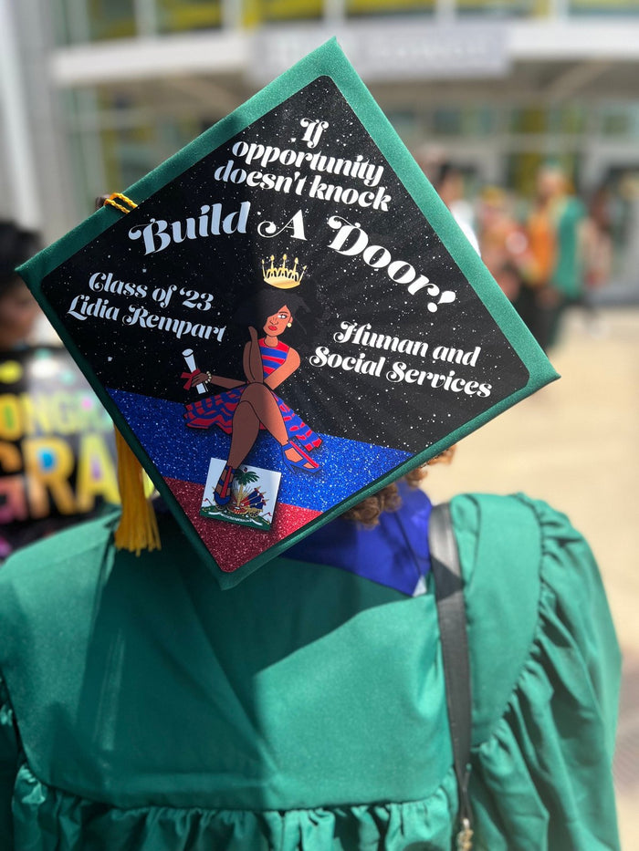 Graduate wearing Build A Door cap