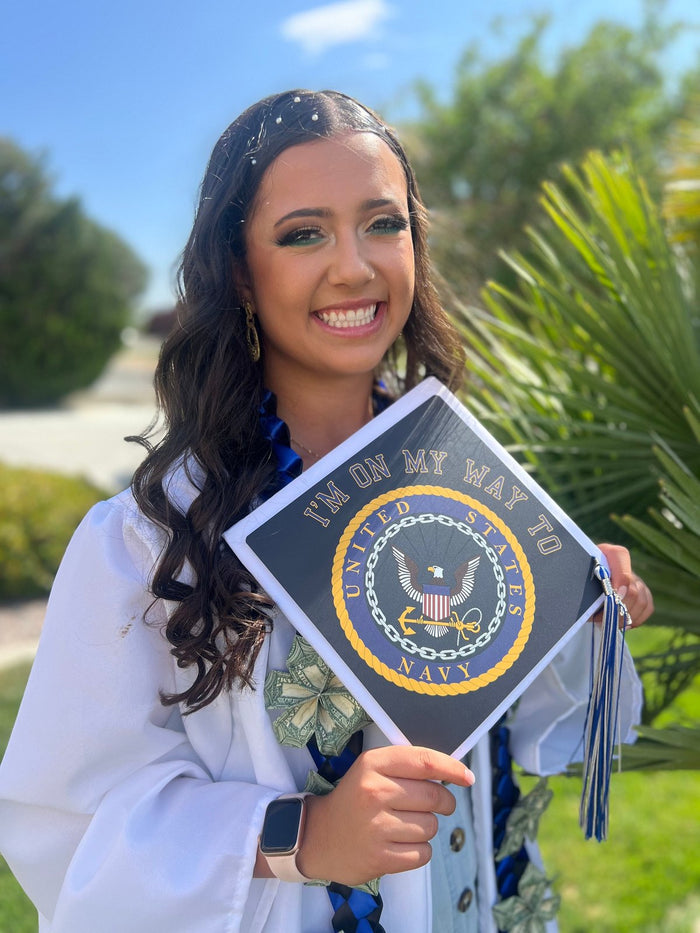 Graduate holding Navy seal On My Way cap