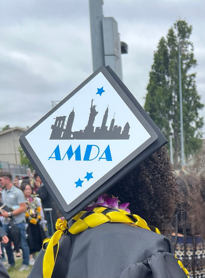 Graduate wearing AMDA skyline cap