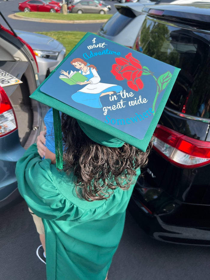 Child wearing Belle adventure cap